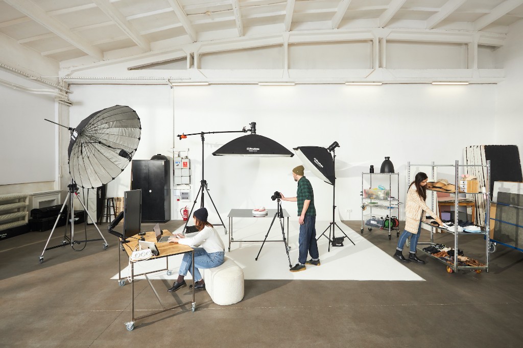 A product shoot at EVG Studio — the team working on the shooting floor by the cyclorama